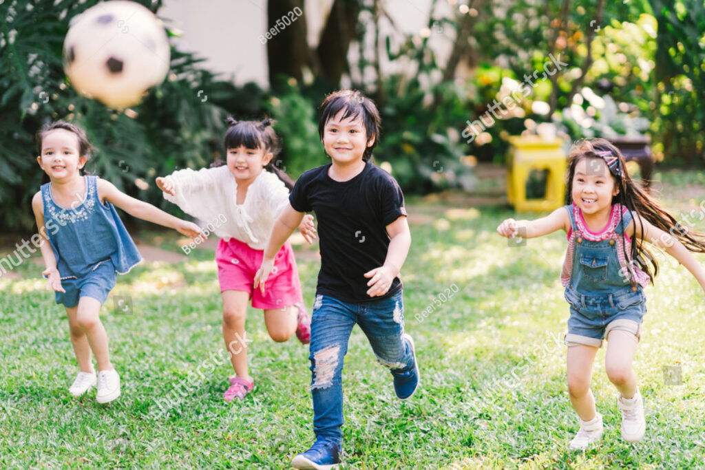 stock-photo-asian-and-mixed-race-happy-young-kids-running-playing-football-together-in-garden-multi-ethnic-1329209570